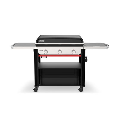 Front view of the Weber Slate 30" Rust-Resistant Griddle with the lid closed, two side tables, three control knobs, and a lower storage shelf.