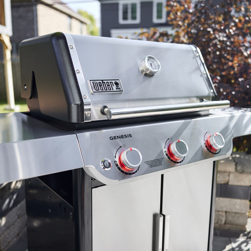 The Weber Genesis Gas Grill features durable stainless steel construction and three burner controls for easy heat adjustment.