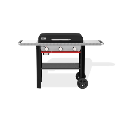 Weber Slate 28" Rust-Resistant Griddle with a closed hard cover, two side tables, three front control knobs, a lower storage shelf, and two wheels.