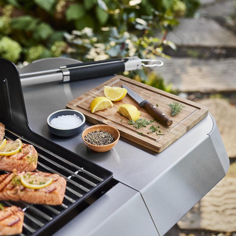 The side table provides space to prep ingredients and keep seasonings and grilling tools within reach.