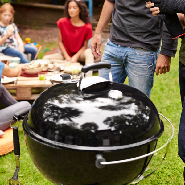 Grilling appetizers at a gameday tailgate on a Weber Kettle Grill – Weber Grills