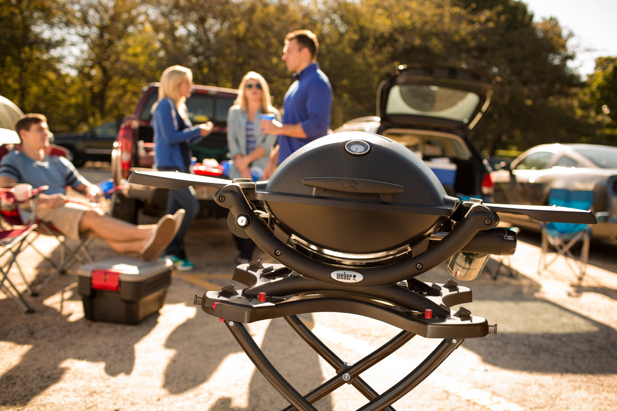 People grilling at a tailgate party - Tailgate at home – Weber Grills