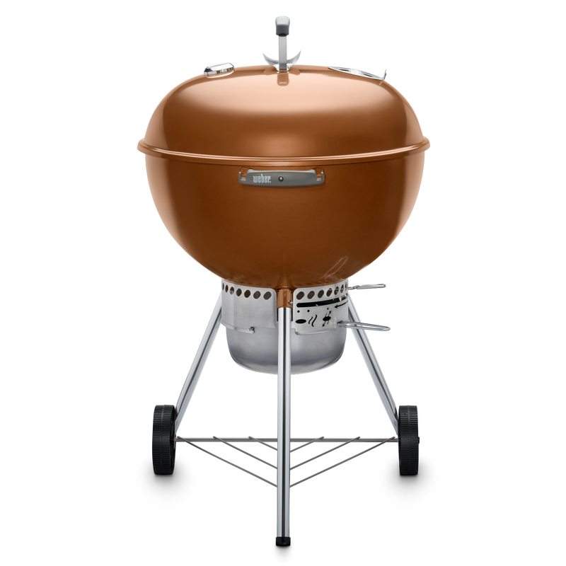 Bronze Weber 22” Original Kettle Premium charcoal grill with adjustable dampers for heat control and an enclosed ash catcher for cleanup.