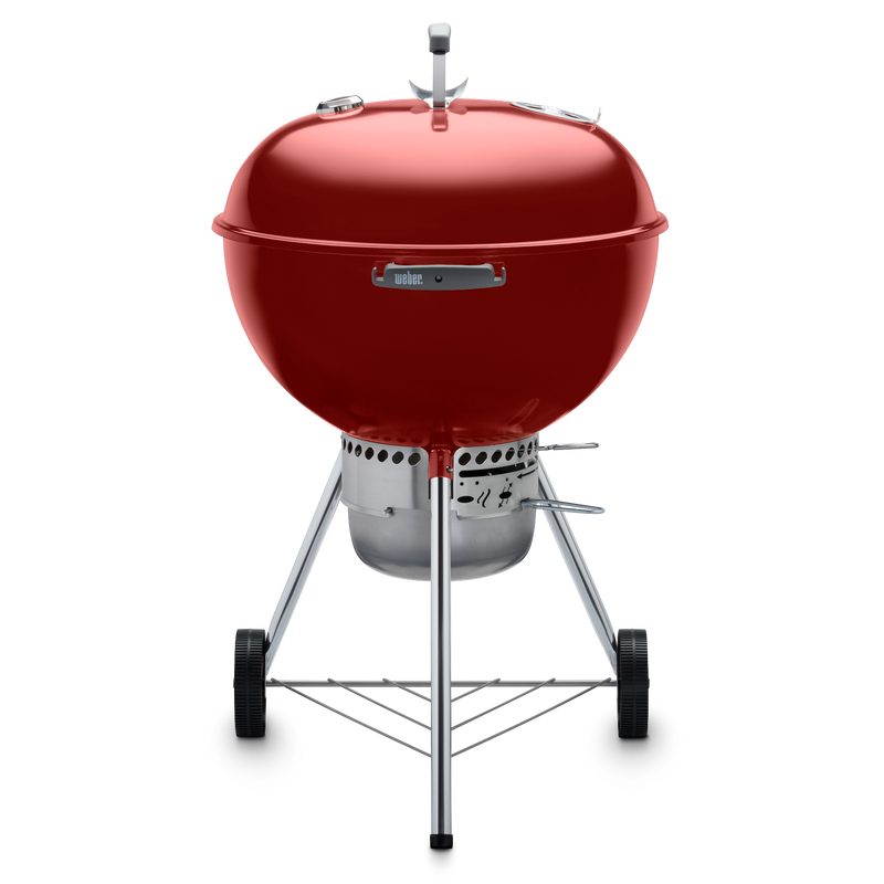 Red Weber 22” Original Kettle Premium charcoal grill with adjustable dampers for heat control and an enclosed ash catcher for cleanup.
