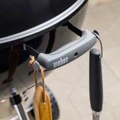 Bowl handle tool hooks on the Weber 22” Original Kettle Premium charcoal grill keep grilling utensils within reach.