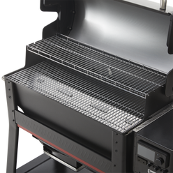 Open Weber Searwood XL 600 wood pellet grill showing the upper and lower cooking grates.