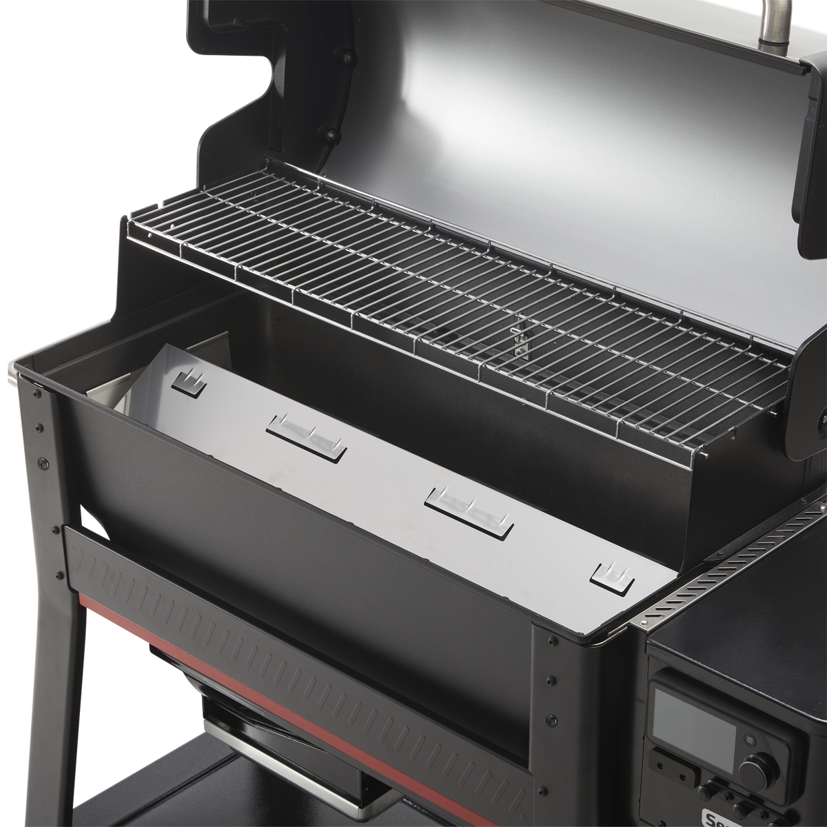 Interior of the Weber Searwood XL 600 wood pellet grill showing the upper cooking grate and heat distribution system.