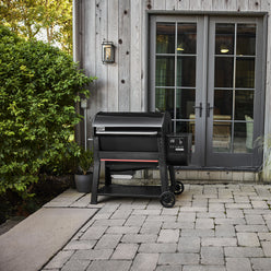 Weber Searwood XL 600 wood pellet grill featured on an outdoor patio.
