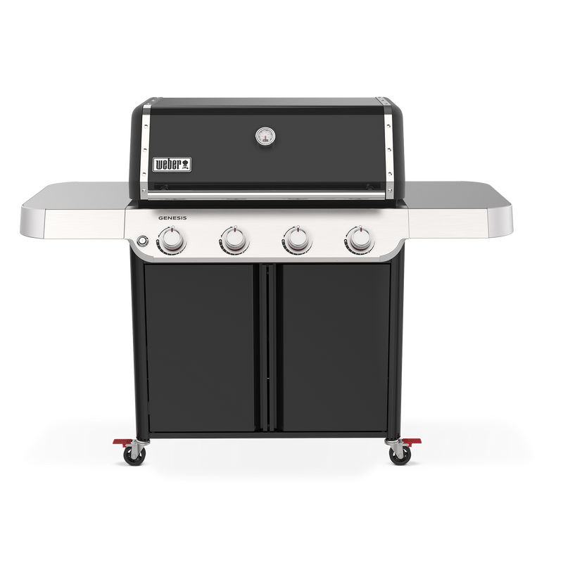 A black lid with a built-in thermometer tops the Weber Genesis E-415 Gas Grill, with four burner controls, two side tables, and a double-door storage cabinet below.
