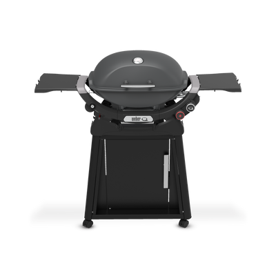 Charcoal Gray Gas Grill on a wheeled cart with a closed domed lid, built-in thermometer, extended side tables, two burner control knobs, and a cabinet door.