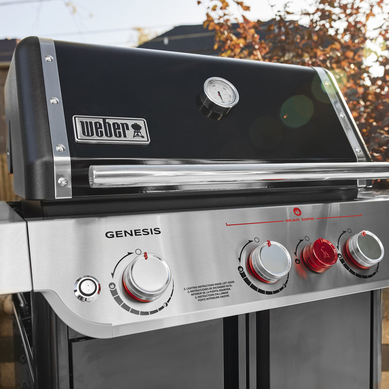 Built-in lid thermometer on the Weber Genesis E-325W Titanium Edition gas grill lets you monitor cooking temperature without opening the lid.