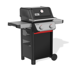 Front-left view of the black Weber Spirit E-210 Gas Grill with the lid closed, a built-in thermometer, two side tables, tool hooks, two control knobs, and a red cabinet handle.
