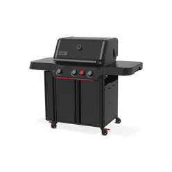 Front-right view of the matte black Weber Genesis E-330 Gas Grill Stealth Edition with the lid closed, two side tables, tool hooks, enclosed storage, and a red Sear Burner knob.