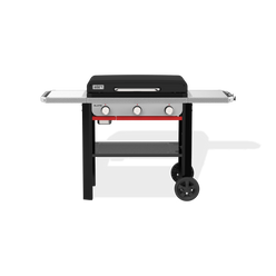 Weber Slate 28" Rust-Resistant Griddle with a closed hard cover, two side tables, three front control knobs, a lower storage shelf, and two wheels.