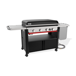 Front-left view of the Weber Slate 36” Rust-Resistant Griddle with the hard cover closed, four control knobs, a digital thermometer, lower storage cabinets and the flip-up side table folded down.