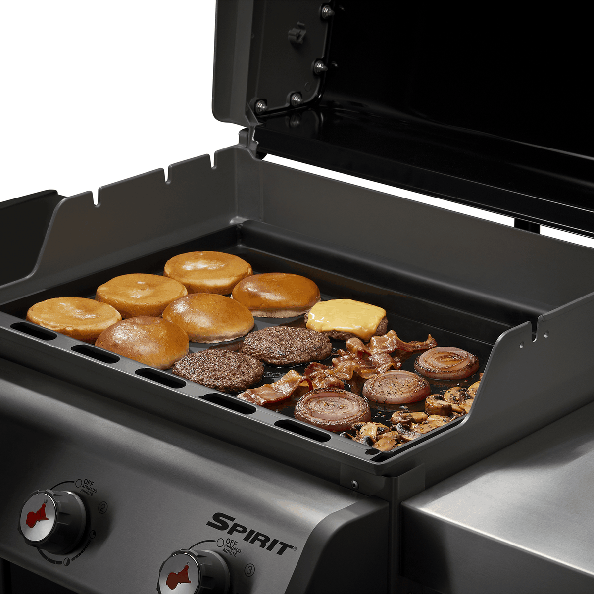 
Weber Rust-Resistant Griddle Insert cooks burgers, bacon, onions, and mushrooms while toasting buns on a Spirit gas grill.