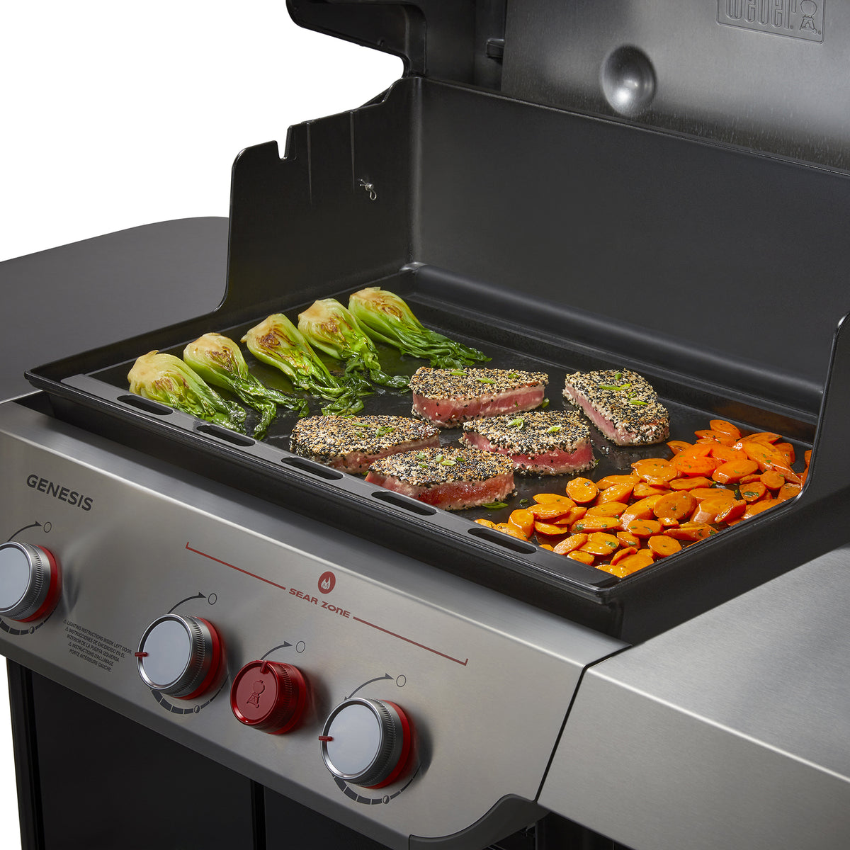 Weber Rust-Resistant Griddle Insert sears sesame-crusted tuna while bok choy and sliced carrots cook alongside for a complete meal.