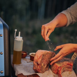 Extra-large prep and serve table provides room to season a large cut of meat and keep ingredients nearby.