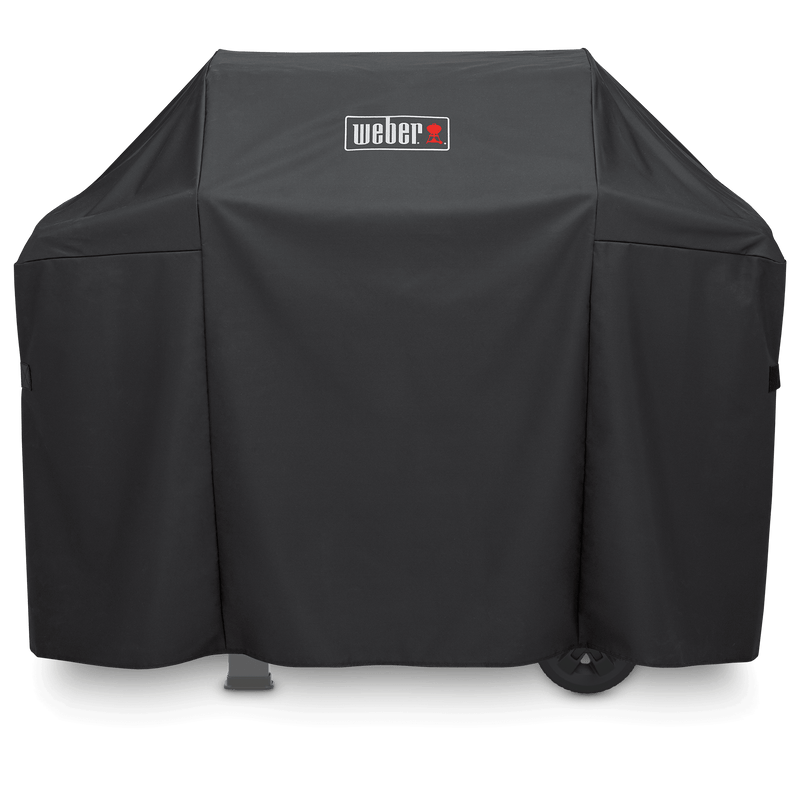 Weber Premium Grill Cover in black fitted over a Spirit grill and side shelves, with a white and red Weber logo on the front.