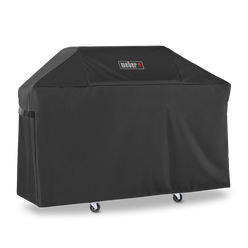 Weber Premium Grill Cover fits over the lid, side tables, and cabinet of a Genesis 3-burner gas grill for weather-resistant protection.