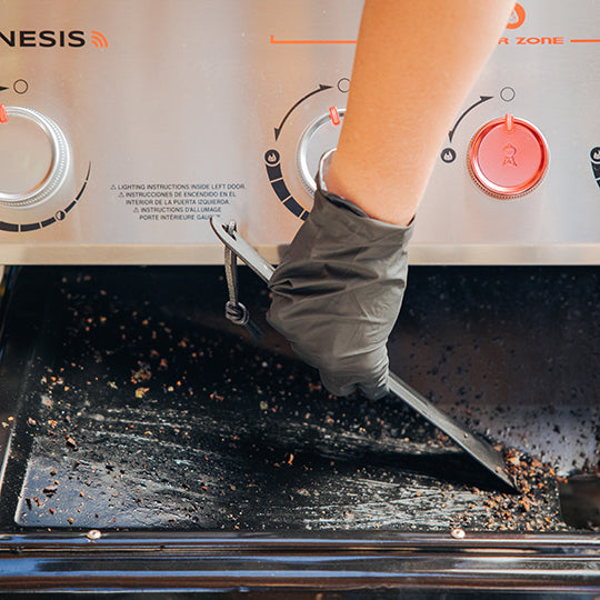 Pull & clean grease management system slides out for scraping away grease and food debris.