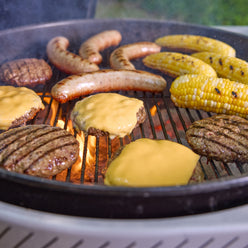 Weber Performer 22” Charcoal Grill provides ample cooking space for burgers, sausages, corn, and other cookout favorites.