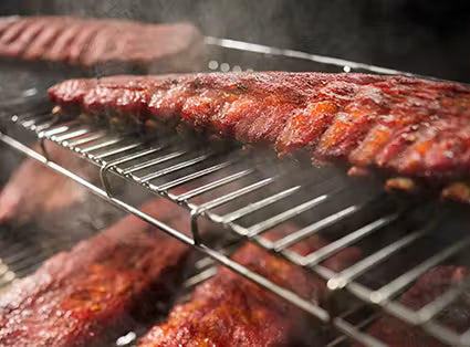 The SmokeBoost™ setting maintains low smoking temperatures, optimizing smoke absorption into the food and intensifying flavor.