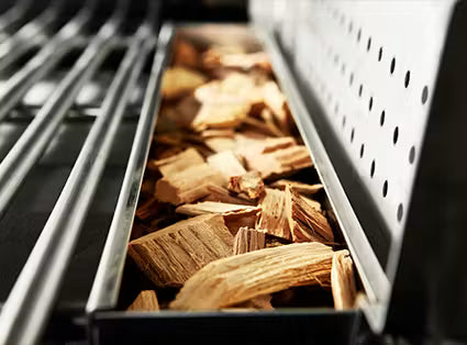Large, stainless-steel smoker box (included) lets you achieve wood-smoked flavor on a gas grill. Box can be placed anywhere on the grill or removed when not in use.