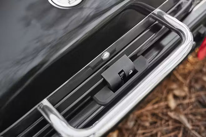 One-piece grill design with locking lid for secure transport.